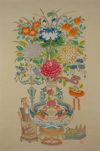 flower vase beside paint brushes